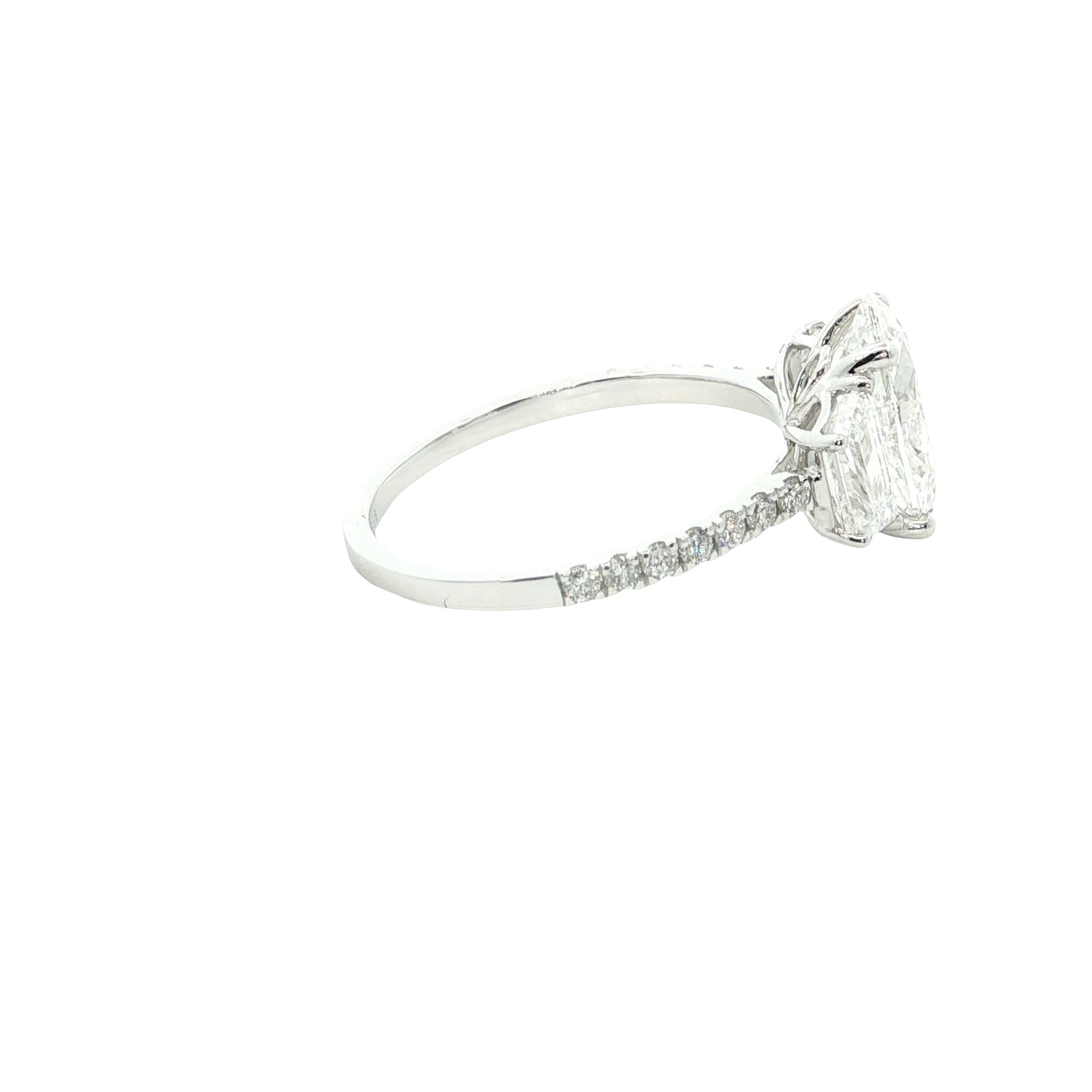 center oval with fancy trapezoid and round brilliant cut diamond engagement ring