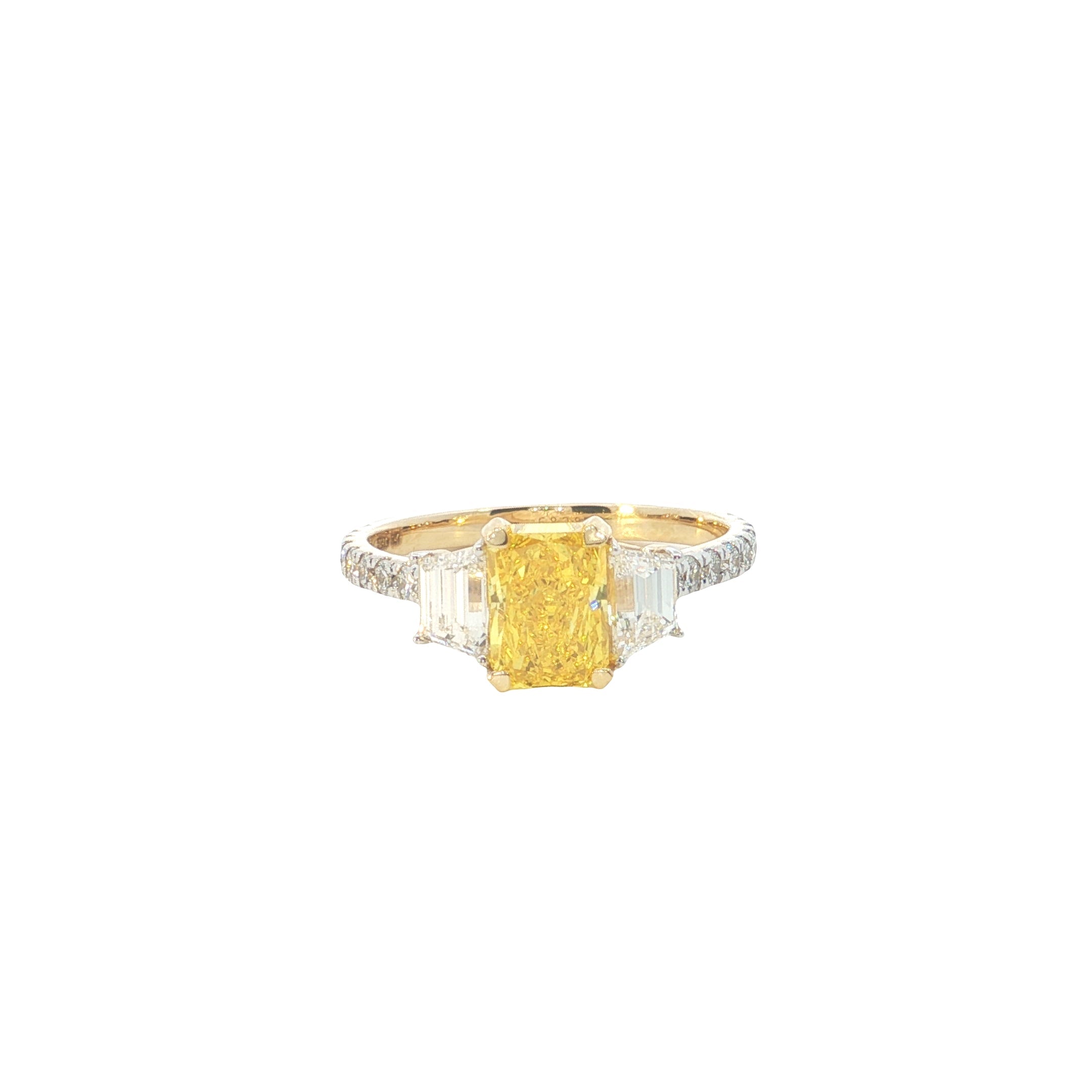 yellow color center radiant  with fancy trapezoid and round brilliant cut diamond engagement ring
