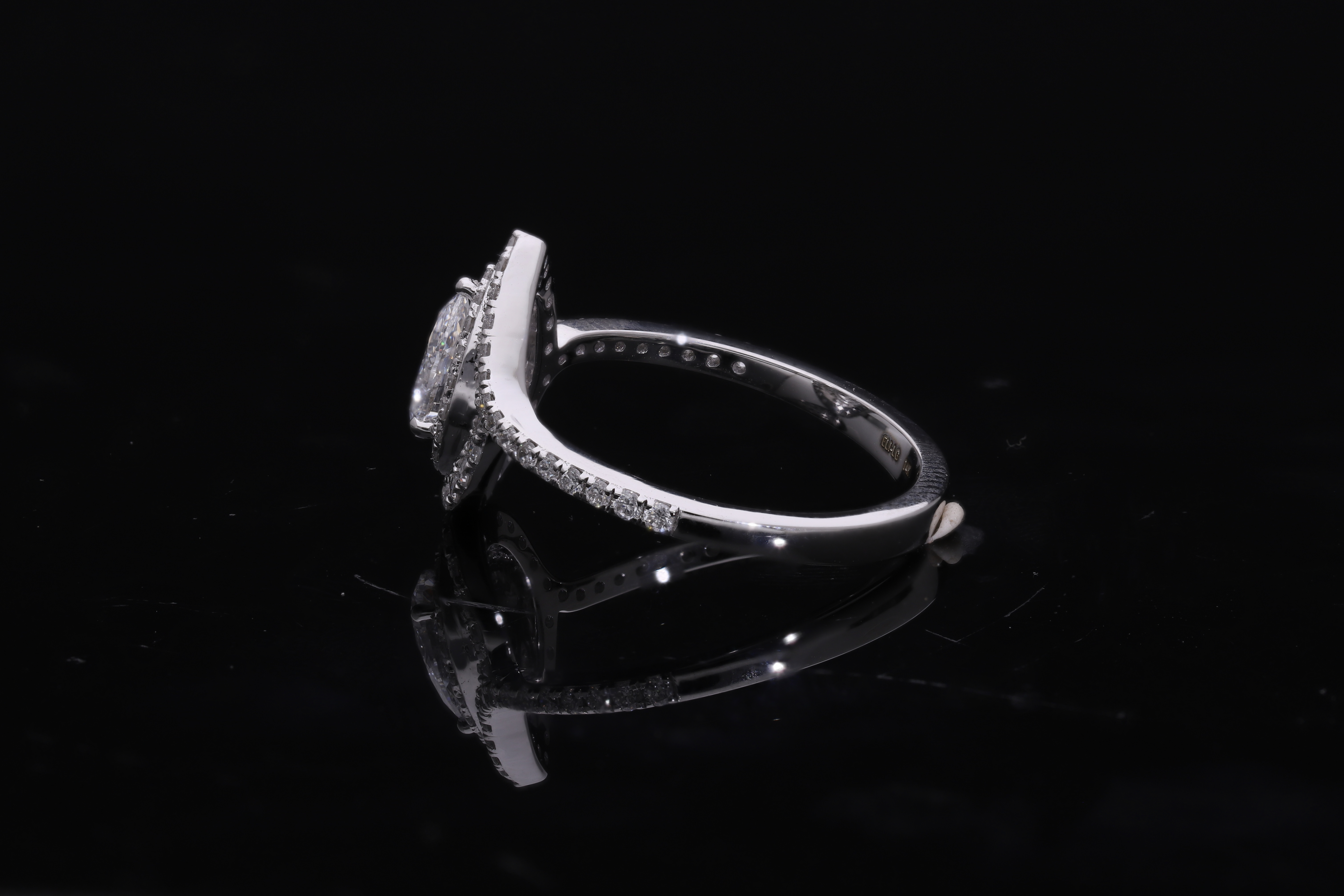 pear center with round brilliant cut halo setting lab grown diamond engagement ring